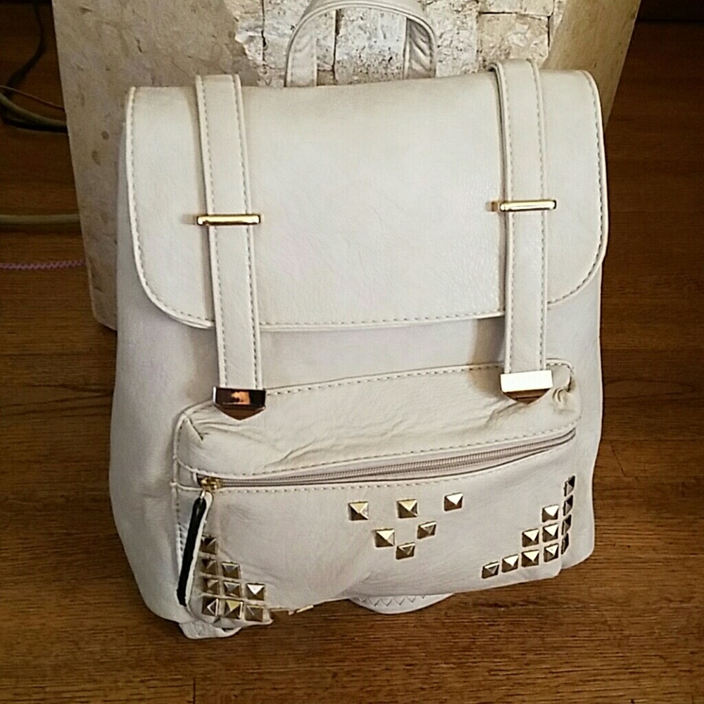 LIGHT TAUPE BACKPACK. 12 by 13 in x 4 in.
